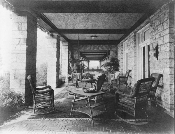 Porch of E.C. Converse house, with wicker furniture, Greenwich, Connecticut, 1908. Creator: Frances Benjamin Johnston.