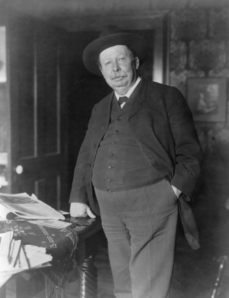 Joel Chandler Harris, three-quarter-length portrait, standing, facing slightly left, c1890 and 1910. Creator: Frances Benjamin Johnston.