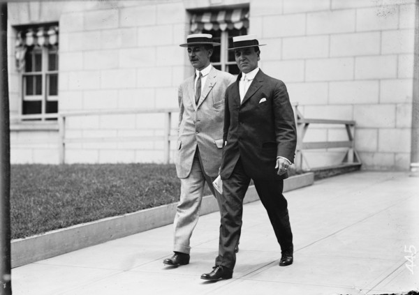 Clarence Funk Leaving S.O.B., [Washington, DC], 1911. [Two men outside the Senate Office Building].