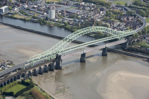 Road and rail bridges over the River Mersey and Manchester Ship Canal at Runcorn Gap, Halton, 2021.