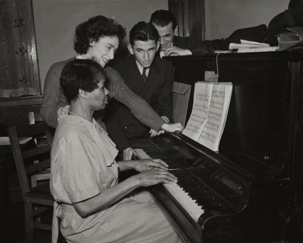 Teacher and student at piano, Jewish Settlement, 1938.