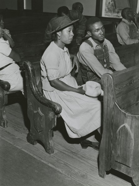 African Americans sitting in pews at a meeting of Farm Security Administration borrowers..., 1941. Creators: Farm Security Administration, Jack Delano.