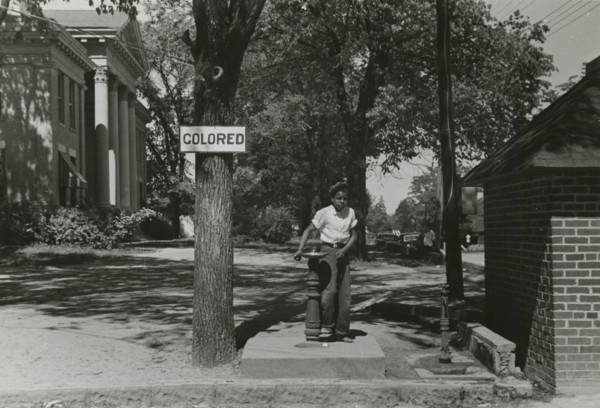 Drinking fountain on the county courthouse lawn, Halifax, North Carolina, 1938-04. Creators: Farm Security Administration, John Vachon.
