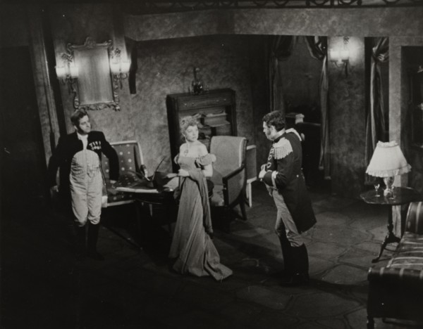 Two men and woman in evening dress, 1938.
