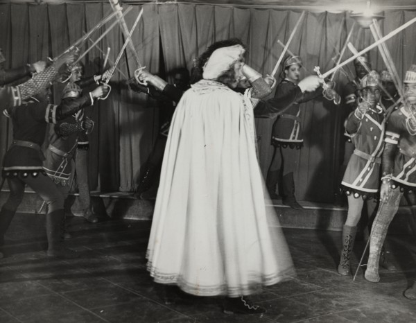 Soldiers with swords raised, 1936.