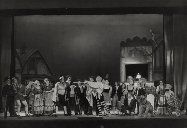 Pinocchio cast with man pointing sticks, 1938-1939.