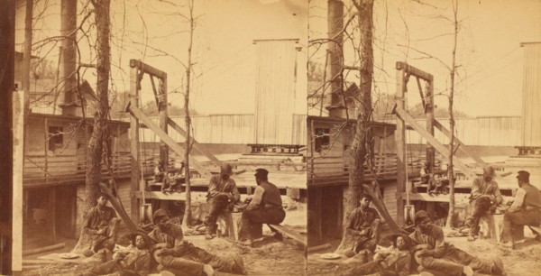 North Carolina. Negro boatmen at lunch, c1850-c1930. Creator: Rufus Morgan.