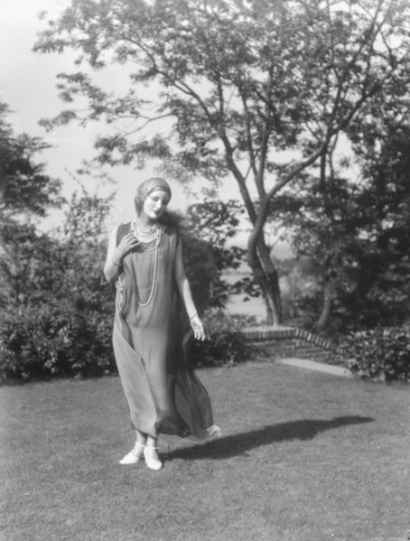 Person wearing a mask made by W.T. Benda, 1925 Sept. 20. Creator: Arnold Genthe.