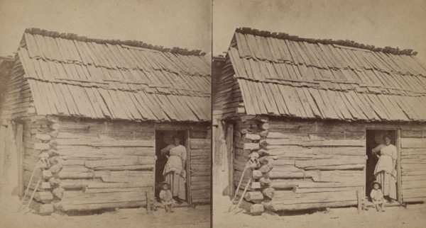 Happy little nig. [Woman and a small child in a cabin doorway], (1868-1900?). Creator: O. Pierre Havens.