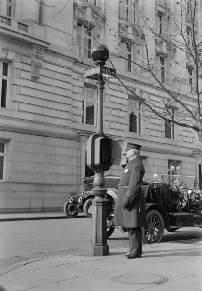 District of Columbia - Fire Alarm Box And Policeman, 1913. Creator: Harris & Ewing.