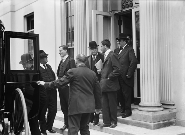 Franklin K. Lane, With Paper in Hand, in Crowd of Newsmen, 1914. Creator: Harris & Ewing.