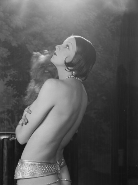 Carise, Erna, Mme., with dog, portrait photograph, 1928 Creator: Arnold Genthe.