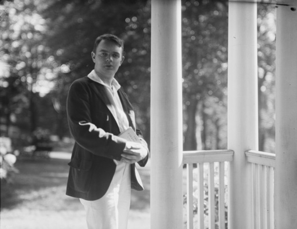 Leslie, Margeurite, friend of, standing on a porch, 1917 Aug. 18. Creator: Arnold Genthe.