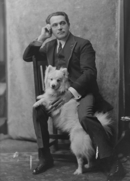 Spirescu, Steraskon, Mr., with dog, portrait photograph, 1917 Mar. 1. Creator: Arnold Genthe.