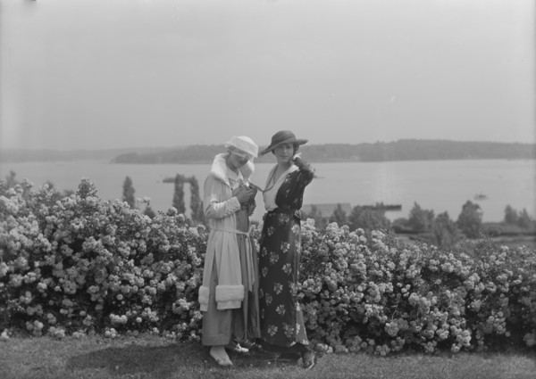 Viola Kraus and Helen Freeman standing outdoors, 1915 June. Creator: Arnold Genthe.