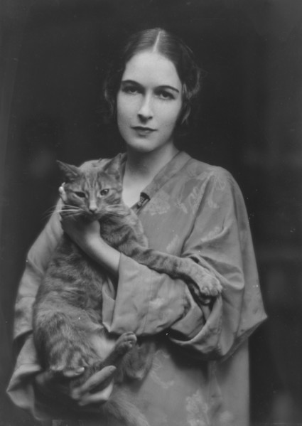Pujo, Mona, Miss, with Buzzer the cat, portrait photograph, 1916. Creator: Arnold Genthe.