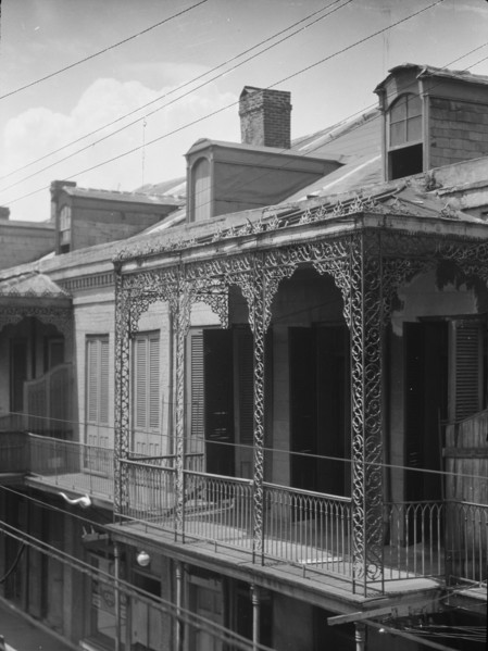 Upper story of building with wrought iron balconies, New Orleans, between 1920 and 1926. Creator: Arnold Genthe.