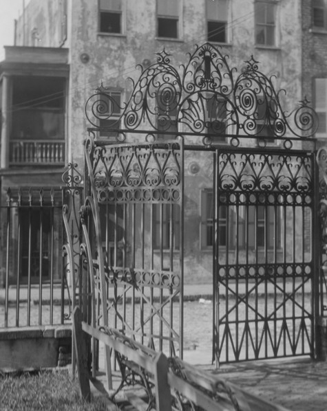 Park gate and houses, [36 Chalmers Street through Washington Park Gate], Charleston..., c1920-c1926. Creator: Arnold Genthe.