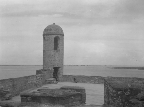 Walls and round tower by the water, Castillo de San Marcos, St. Augustine, Florida, c1920-c1926. Creator: Arnold Genthe.