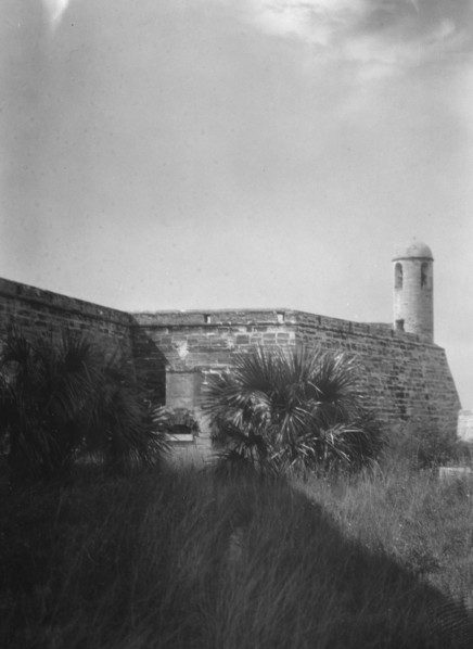 Walls and round tower by the water, Castillo de San Marcos, St. Augustine, Florida, c1920-c1926. Creator: Arnold Genthe.