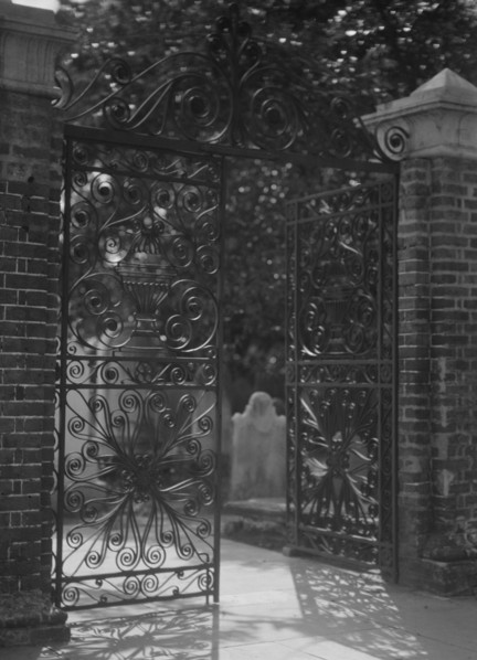 Gates on Broad Street to the graveyard at St. Michael's Episcopal Church, Charleston..., c1920-1926. Creator: Arnold Genthe.