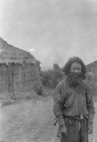 Ainu man standing outside, 1908. Creator: Arnold Genthe.