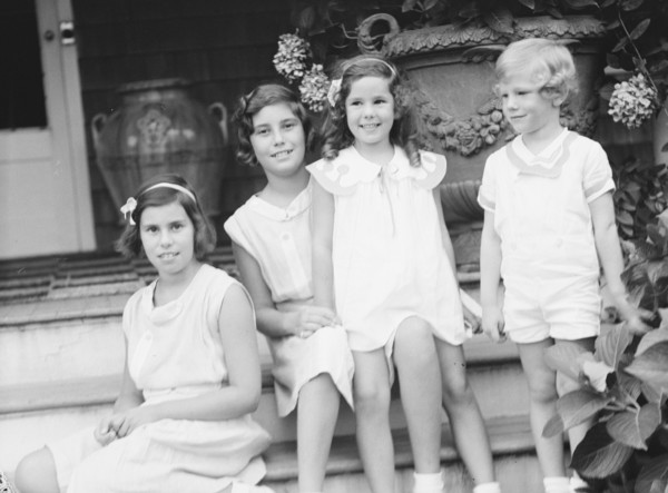 Children of W.G. Kimball, seated on the steps of their house, between 1911 and 1942. Creator: Arnold Genthe.