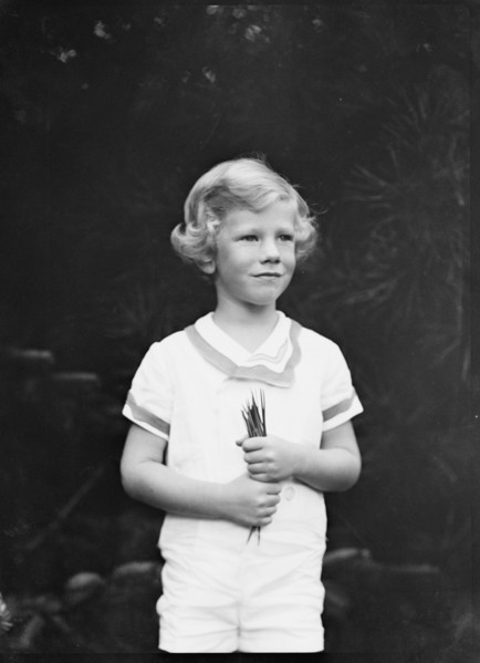 Son of W.G. Kimball, standing outdoors, between 1911 and 1942. Creator: Arnold Genthe.