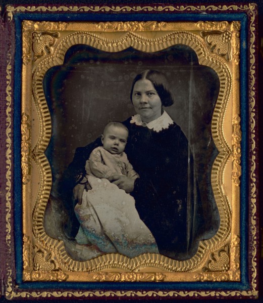Lucy Stone, with Alice Stone Blackwell, half-length portrait of a woman, seated..., 1857 or 1858. Creator: Unknown.