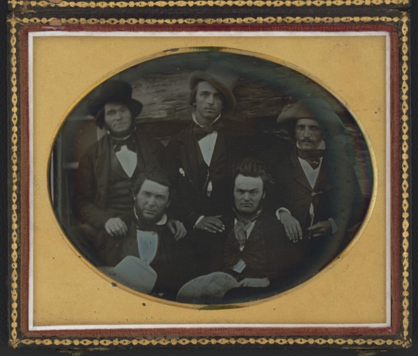 Five men posed at a fort or trading post, possibly at Scottsbluff, Nebraska..., ca. 1851-1852. Creator: Unknown.