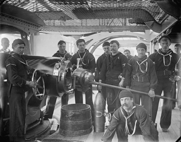 U.S.S. New York, breech of 8 inch gun and crew, between 1893 and 1901. Creator: William H. Jackson.