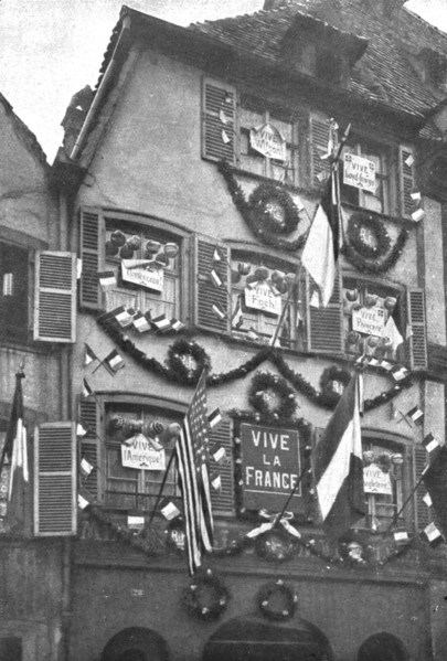 'Petain et Foch a Strasbourg; La parure de fete de Strasbourg liberee: deux facades ornees...,1918. Creator: Unknown.