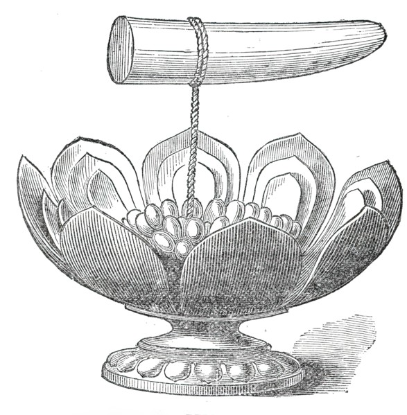 The Dalada, or tooth relic of Buddha, and golden lotus flower in the Maligawa Temple, Kandy..., 1876 Creator: Unknown.