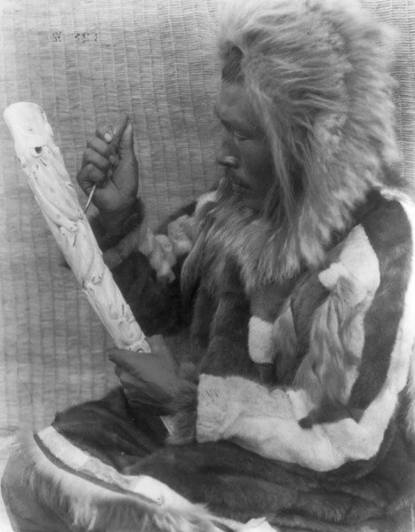 The ivory carver-Nunivak, c1929. Creator: Edward Sheriff Curtis.