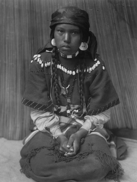 Touch her dress-Kalispel, c1910. Creator: Edward Sheriff Curtis.