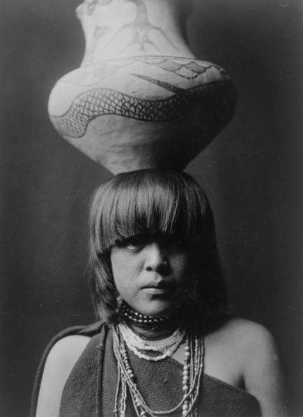 Girl and jar-San Ildefonso, c1927. Creator: Edward Sheriff Curtis.