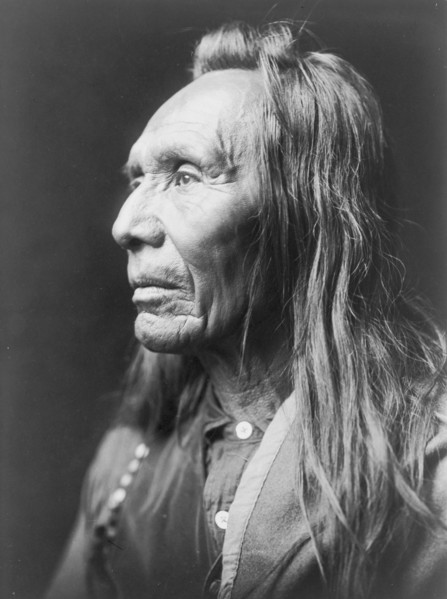 Three Eagles, a Nez Percé Indian, head-and-shoulders portrait, facing left, c1910. Creator: Edward Sheriff Curtis.
