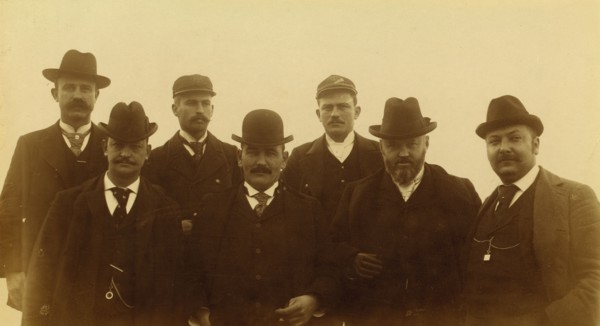 Seven men, half-length portrait, facing front,1894 or 1895. Creator: Alfred Lee Broadbent.
