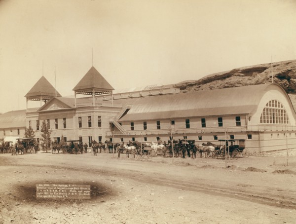 Hot Springs, SD Exterior view of largest plunge bath house in US on FE and MV R'y, 1891. Creator: John C. H. Grabill.