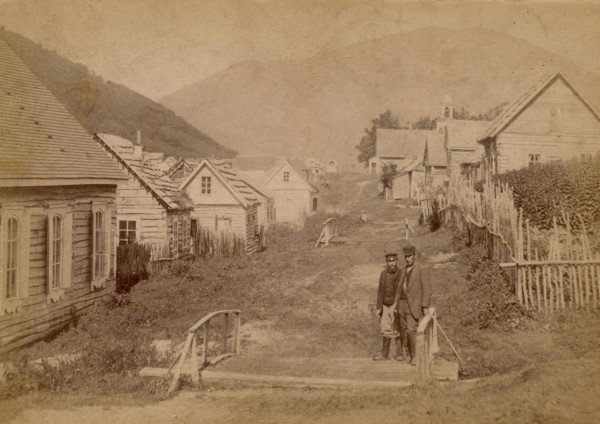 Main street in Petropavlovsk in Kamchatka. View of Mishennaya Sopka, 1890.  Creator: Unknown.