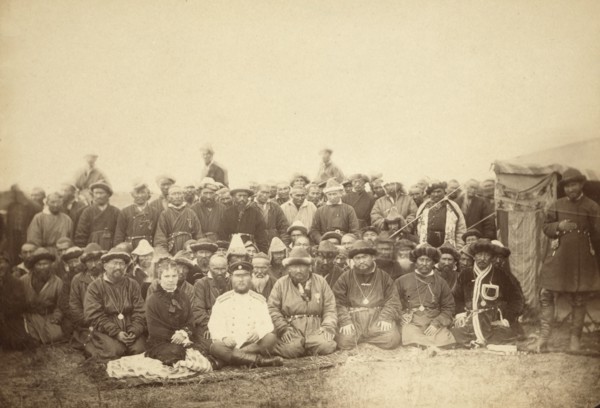 Kirghiz (ie Kazakh) tribesmen with a local Russian Governor and his wife, between 1885 and 1886. Creator: Unknown.