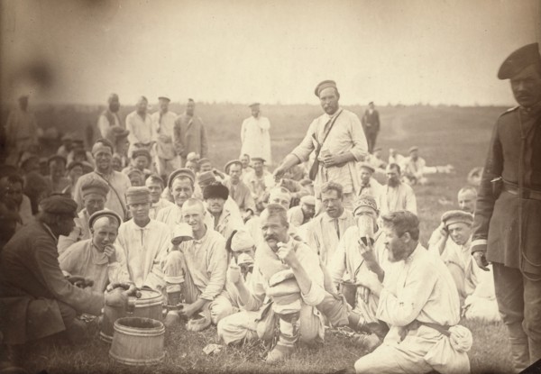 Siberian convicts taking lunch by the roadside (common criminals), between 1885 and 1886. Creator: Unknown.