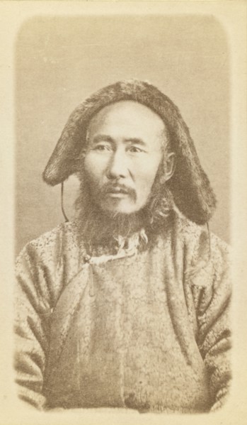 Half-length portrait of man, seated, facing slightly left, between 1870 and 1886. Creator: Unknown.