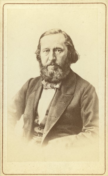 A Aksakov, half-length portrait, facing front, between 1880 and 1886. Creator: Unknown.