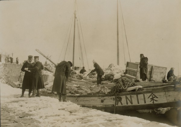 Japanese officers directing the unloading of supplies, Chemulpo, c1904. Creator: Robert Lee Dunn.