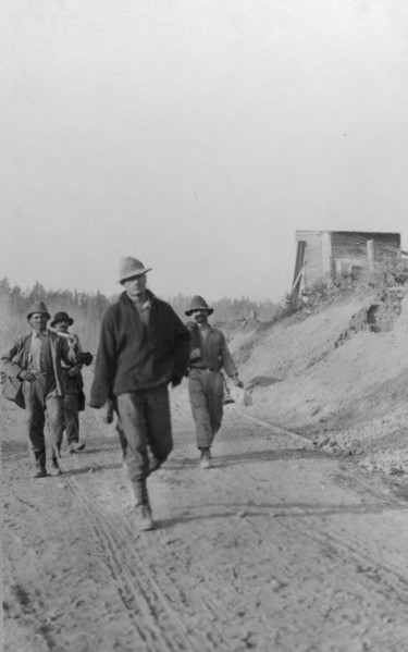 Men walking on dirt road, between c1900 and 1916. Creator: Unknown.