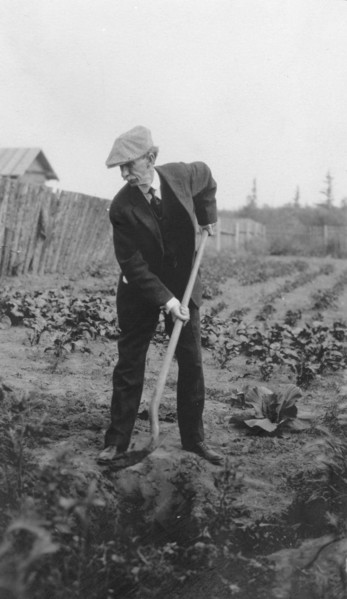 Frank G. Carpenter in a garden, between c1900 and 1916. Creator: Unknown.