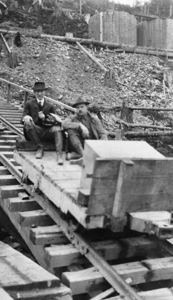 Frank G. Carpenter and man sitting on tracks, between c1900 and 1924. Creator: Unknown.