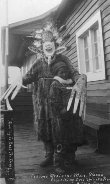 Eskimo medicine man and sick boy, between c1900 and c1930. Creator: Unknown.