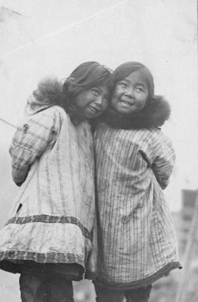 Two Eskimo girls standing side by side, between c1900 and c1930. Creator: Unknown.